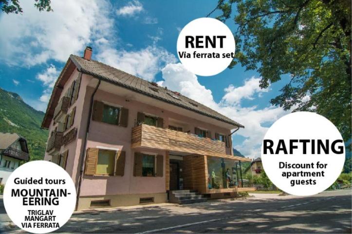 ein Haus mit drei Blasen, die sich auf ein Gebäude beziehen in der Unterkunft Apartments and Rooms Skok in Bovec