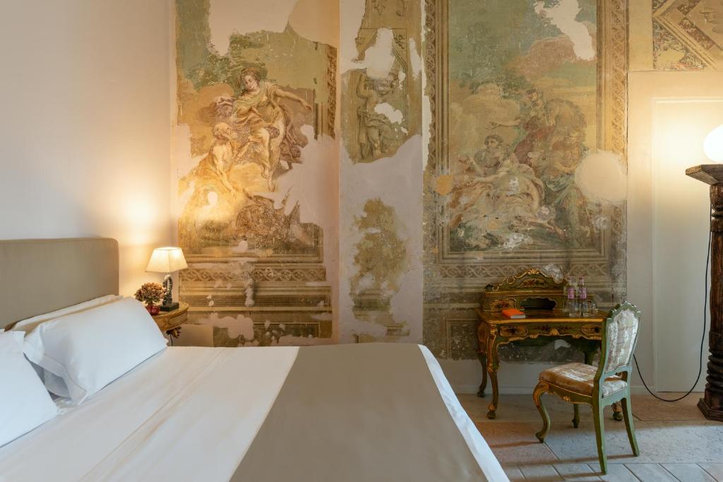 Postel nebo postele na pokoji v ubytování Hotel Palazzo Novello