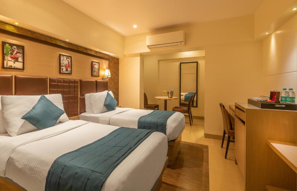 Postel nebo postele na pokoji v ubytování Hotel Oriental Aster - Mumbai International Airport