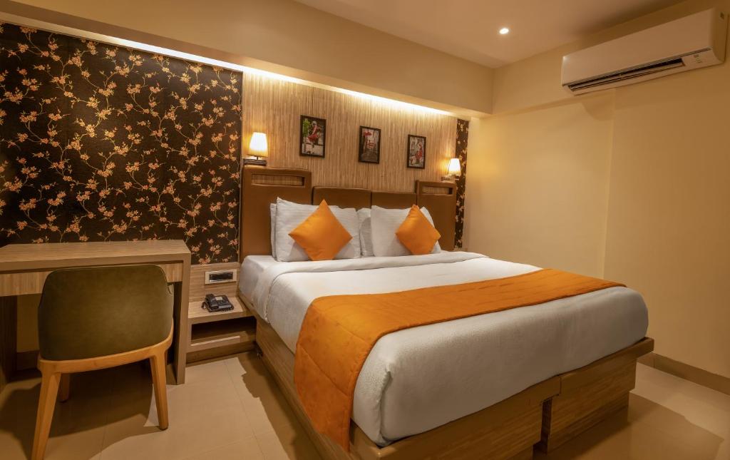 Postel nebo postele na pokoji v ubytování Hotel Oriental Aster - Mumbai International Airport