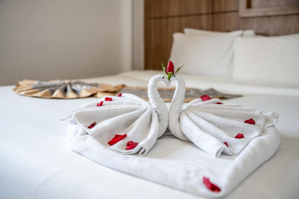 Postel nebo postele na pokoji v ubytování Valencia Da Nang Beach Hotel