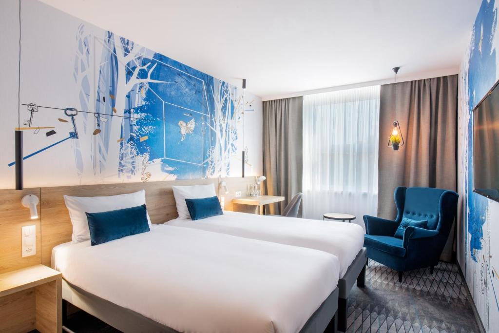 Postel nebo postele na pokoji v ubytování ibis Styles Kraków East