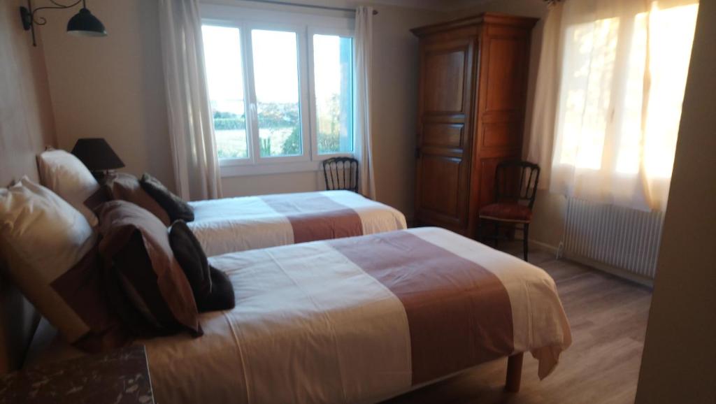 Postel nebo postele na pokoji v ubytování L'Esperluette en Camargue