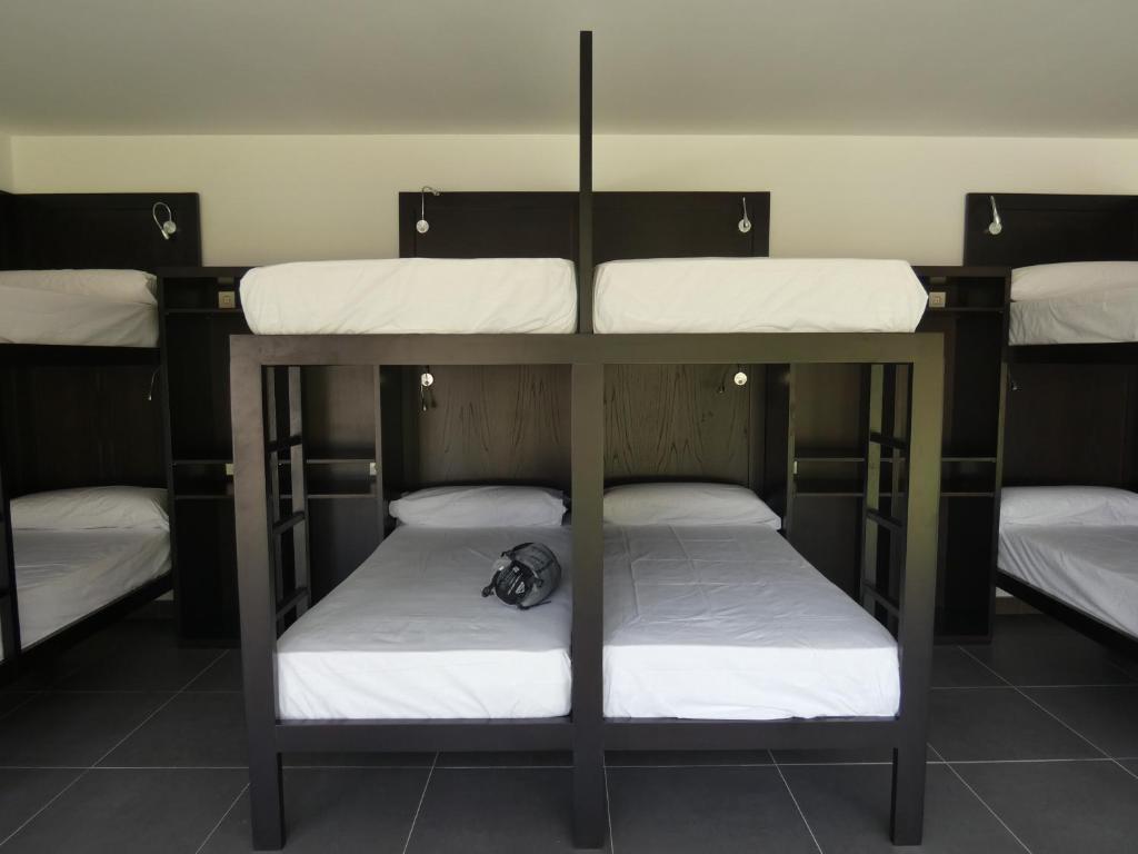 Postel nebo postele na pokoji v ubytování Albergue Casa Sueño