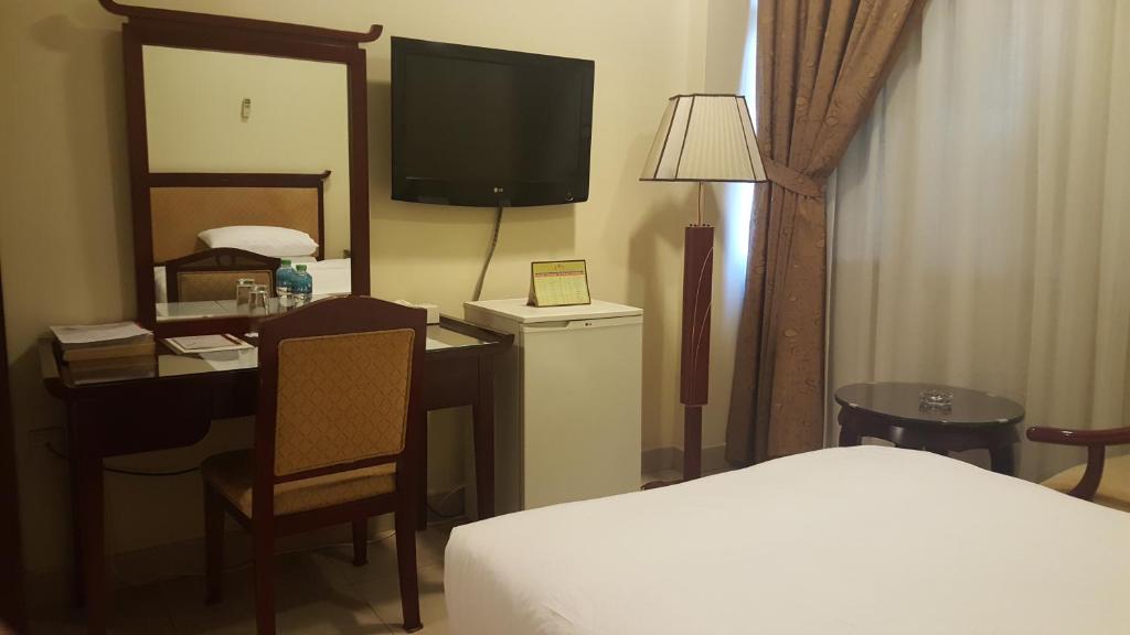 Postel nebo postele na pokoji v ubytování Al Muntazah Plaza Hotel