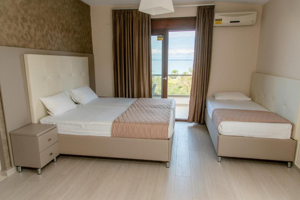 Posteľ alebo postele v izbe v ubytovaní Villa Diamantis Apartments