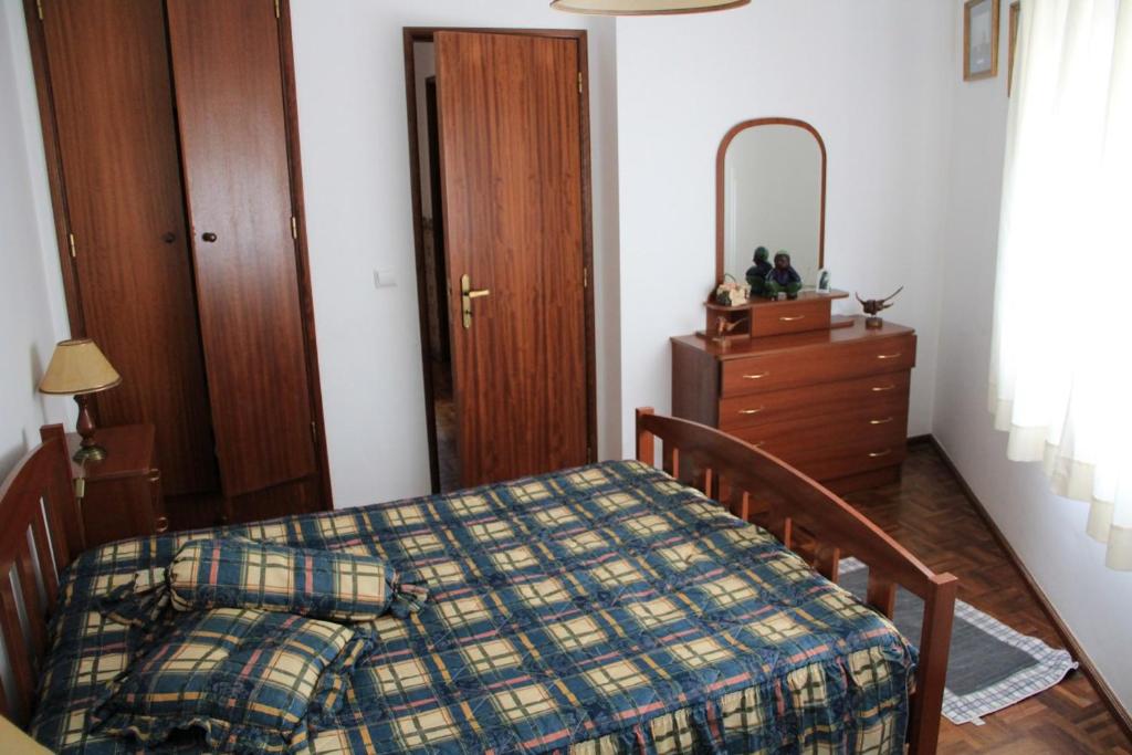 Postel nebo postele na pokoji v ubytování Casa Praia Légua