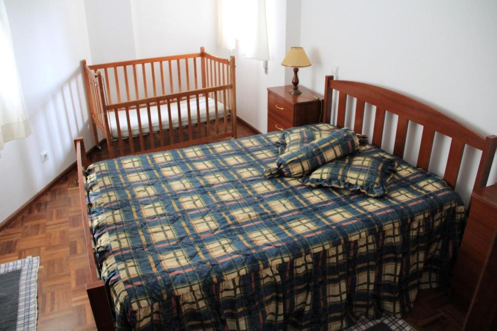 Postel nebo postele na pokoji v ubytování Casa Praia Légua