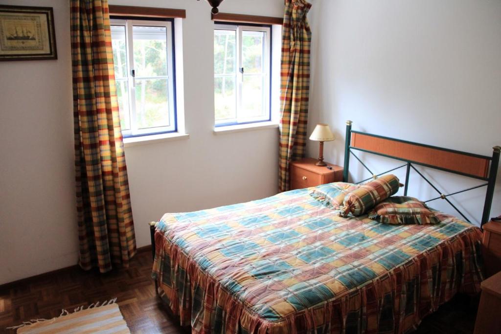 Postel nebo postele na pokoji v ubytování Casa Praia Légua
