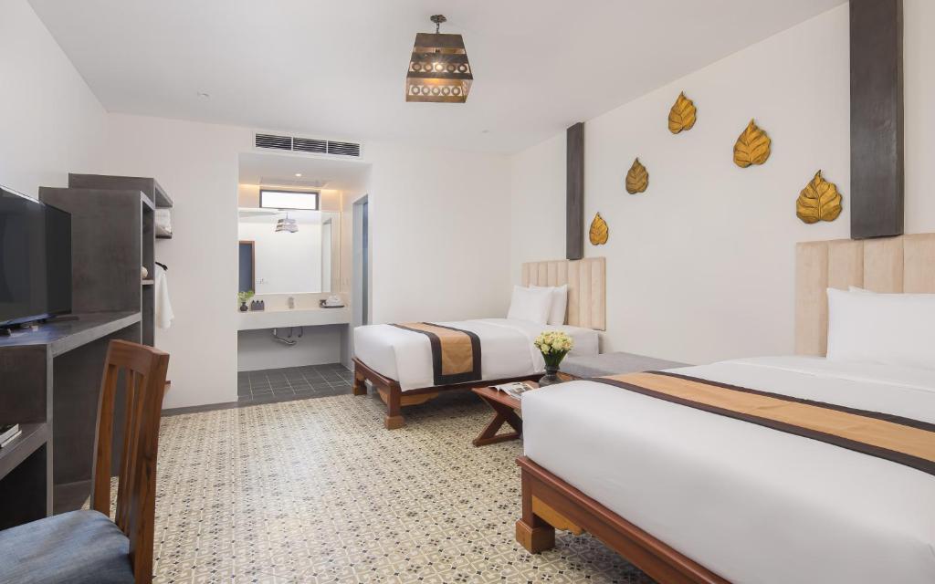 Postel nebo postele na pokoji v ubytování Siem Reap Palace Hotel & Spa
