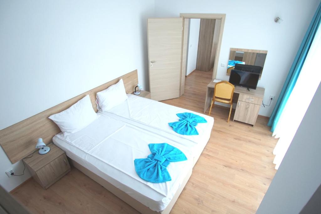 Postel nebo postele na pokoji v ubytování Hotel Elitza