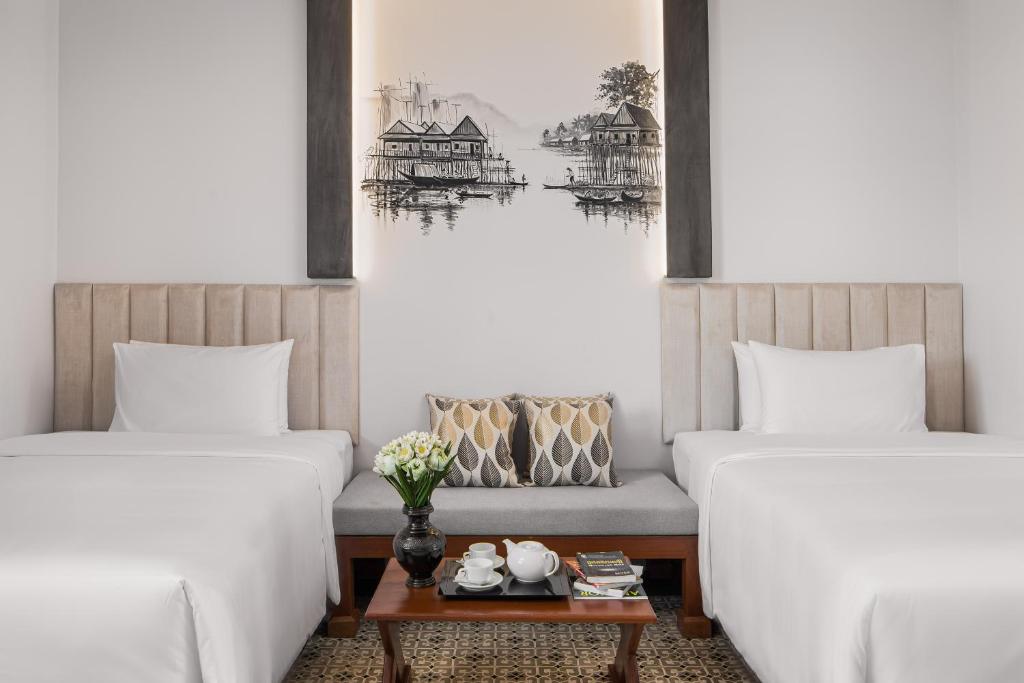 Postel nebo postele na pokoji v ubytování Siem Reap Palace Hotel & Spa