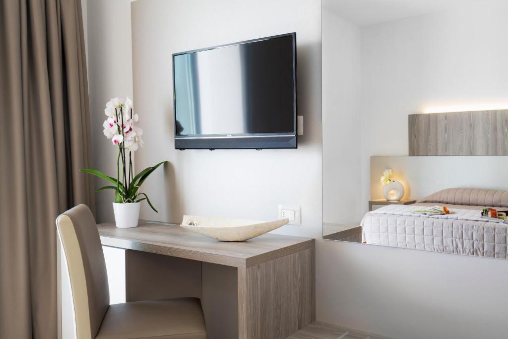 A bed or beds in a room at Forte 2 Hotel