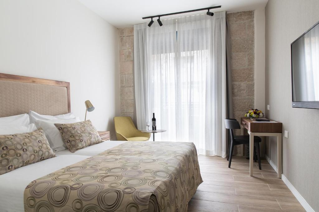 Postel nebo postele na pokoji v ubytování Montefiore Hotel By Smart Hotels
