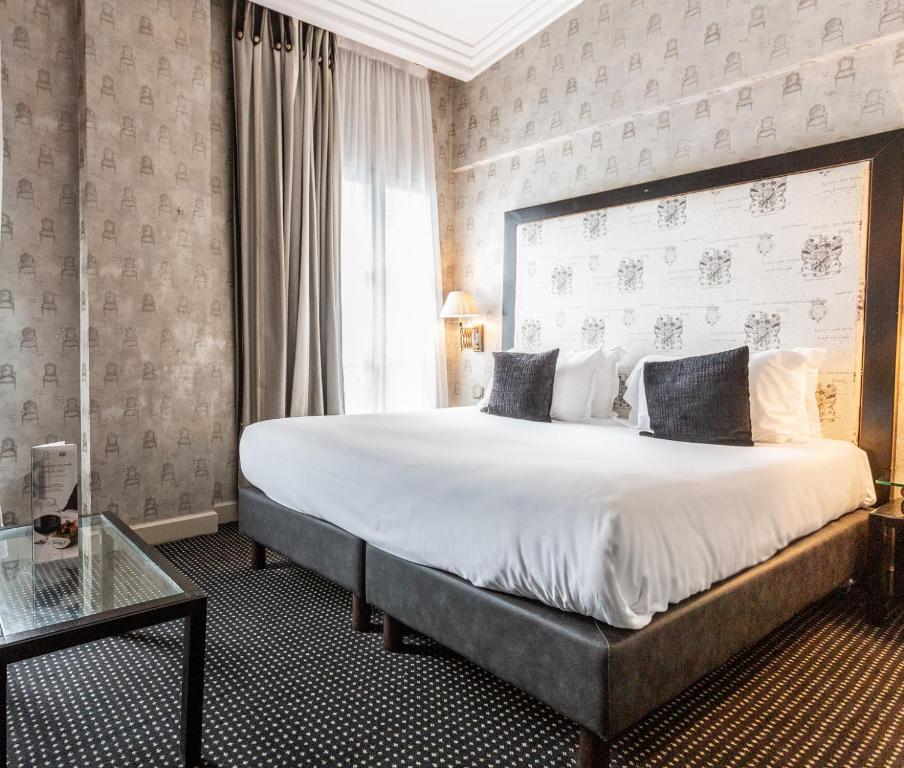 Voodi või voodid majutusasutuse Villa Lutèce Port Royal toas