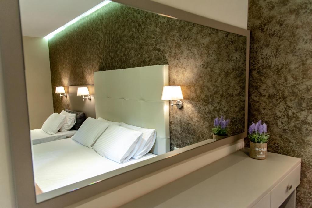 Posteľ alebo postele v izbe v ubytovaní Villa Diamantis Apartments
