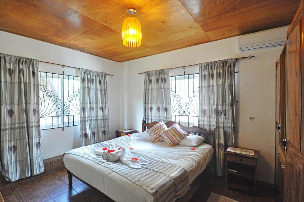 Postel nebo postele na pokoji v ubytování Acquario Guesthouse