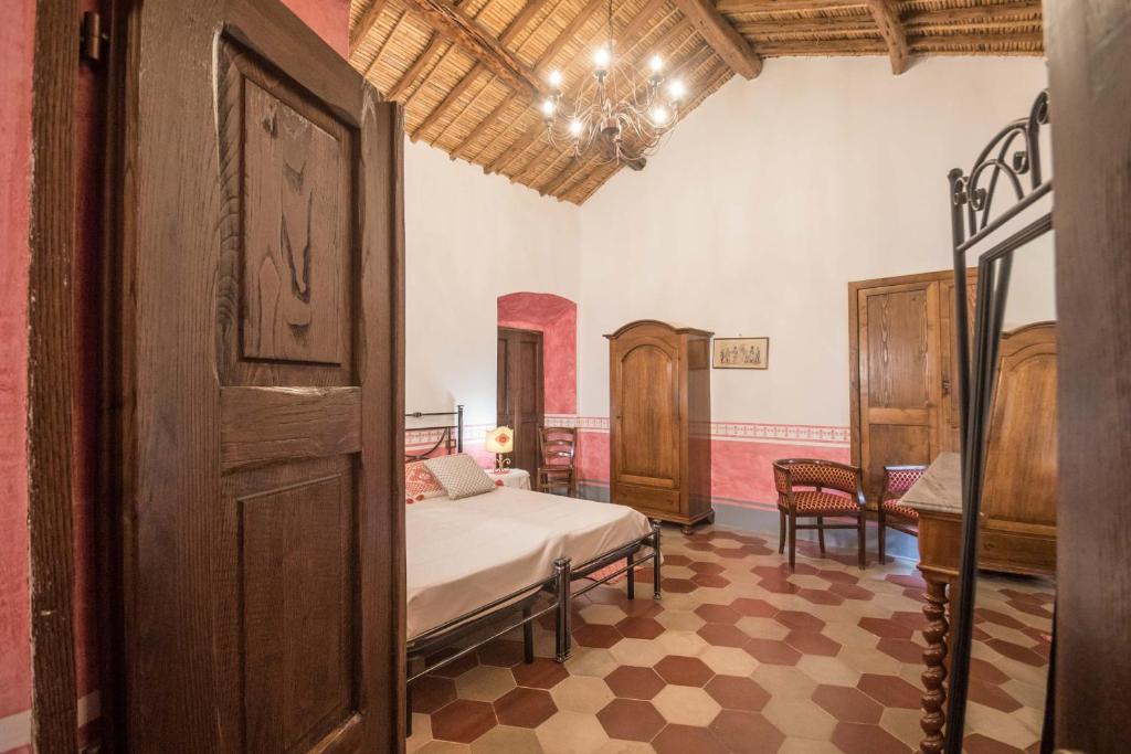 Postel nebo postele na pokoji v ubytování Hotel Anticos Palathos