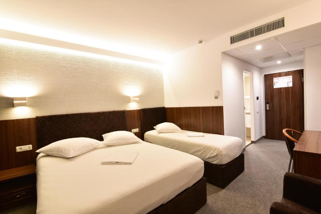 Postel nebo postele na pokoji v ubytování Hotel Forum