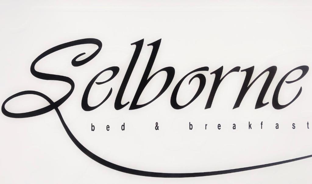 a close up of the calligraphy of the siren signature at Selborne Bed and Breakfast in East London