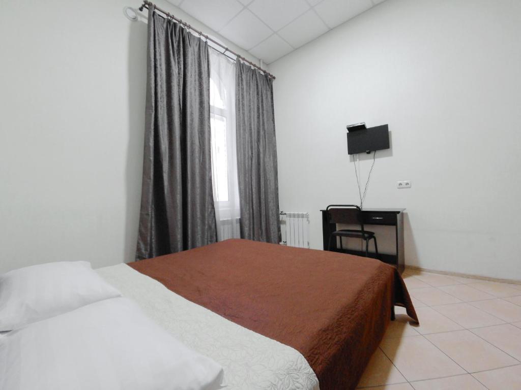 Postel nebo postele na pokoji v ubytování Mini hotel Non-Stop