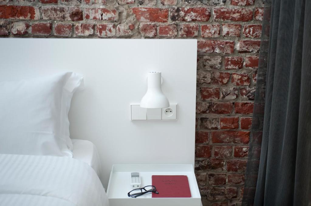 Postel nebo postele na pokoji v ubytování 9Hotel Central