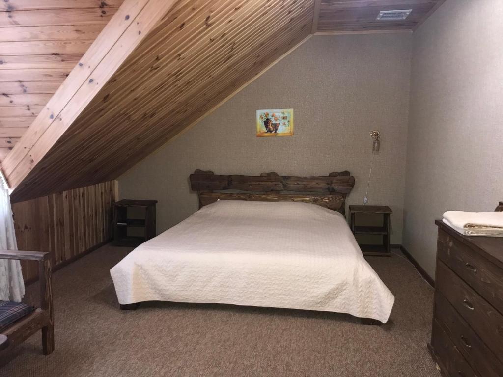 Postel nebo postele na pokoji v ubytování Polyanskiy Zamok