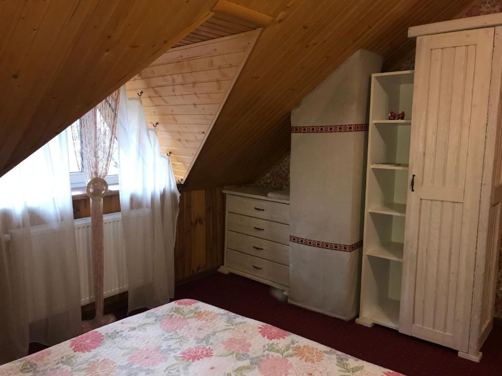 Postel nebo postele na pokoji v ubytování Polyanskiy Zamok