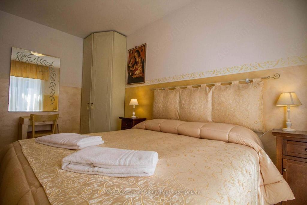 Postel nebo postele na pokoji v ubytování Agriturismo Baldassari