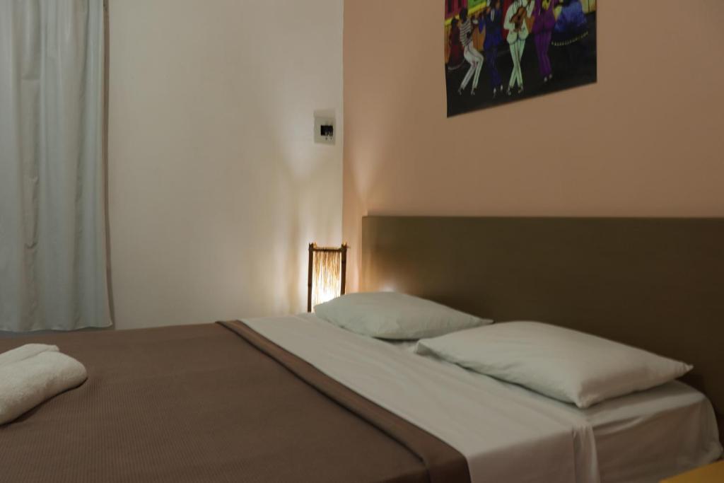 Postel nebo postele na pokoji v ubytování Pousada Liras da Poesia