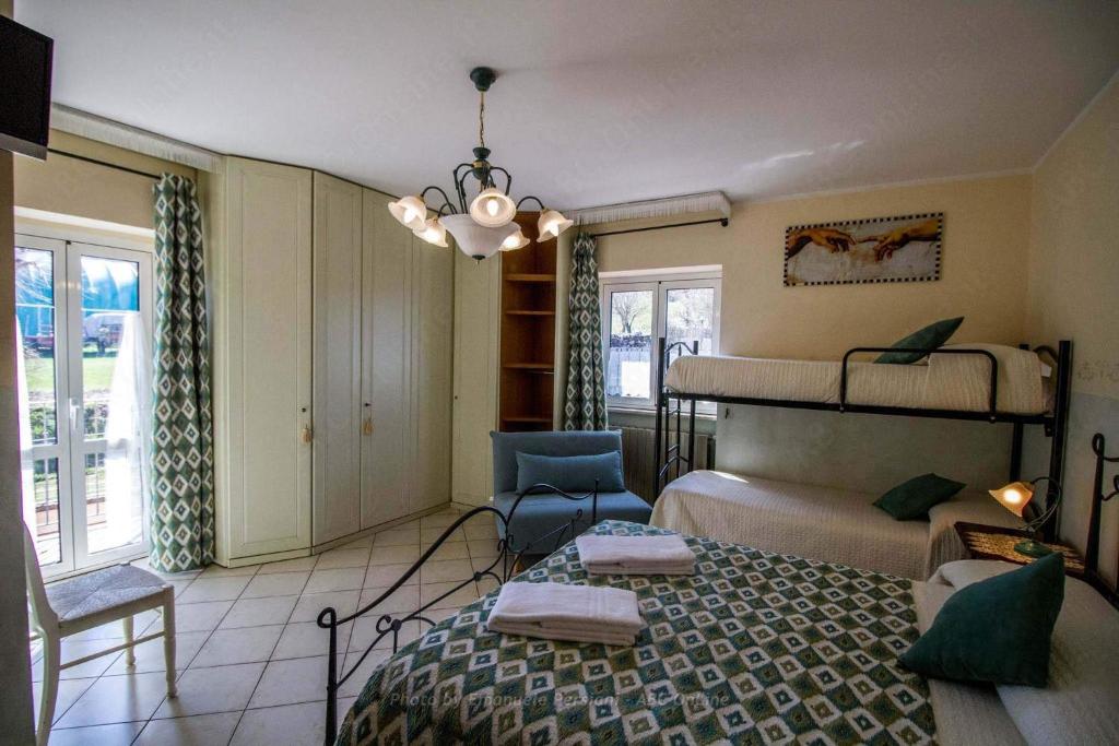 Postel nebo postele na pokoji v ubytování Agriturismo Baldassari