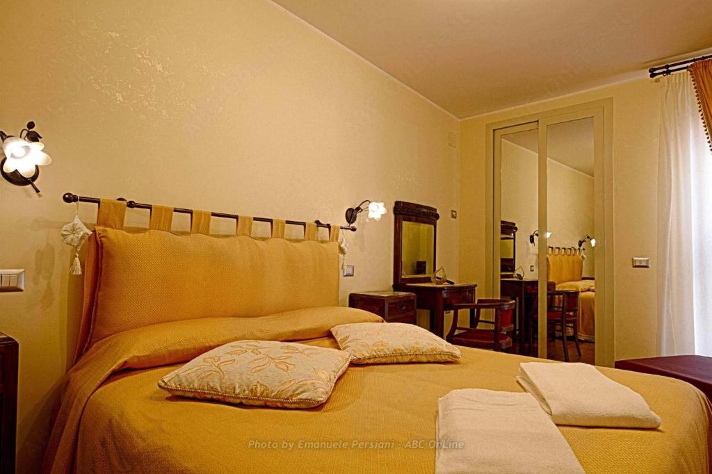 Postel nebo postele na pokoji v ubytování Agriturismo Baldassari