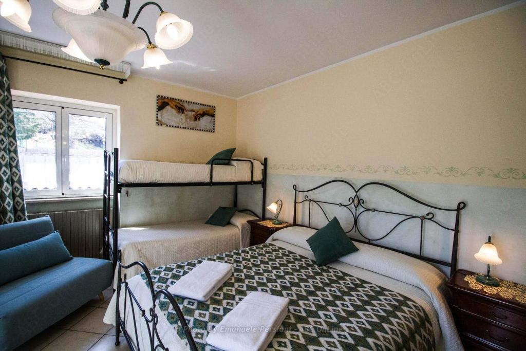 Postel nebo postele na pokoji v ubytování Agriturismo Baldassari