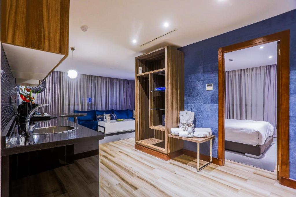 Postel nebo postele na pokoji v ubytování SBN Suite Hôtel
