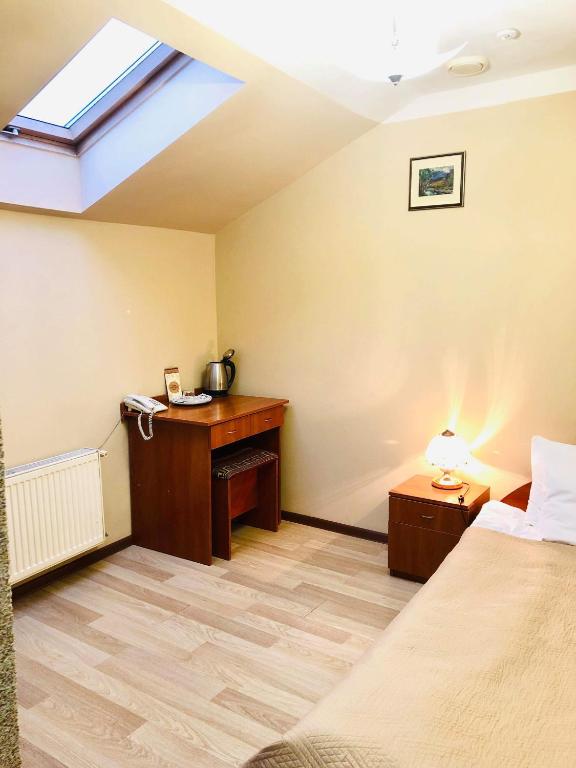 Postel nebo postele na pokoji v ubytování Atlant Hotel