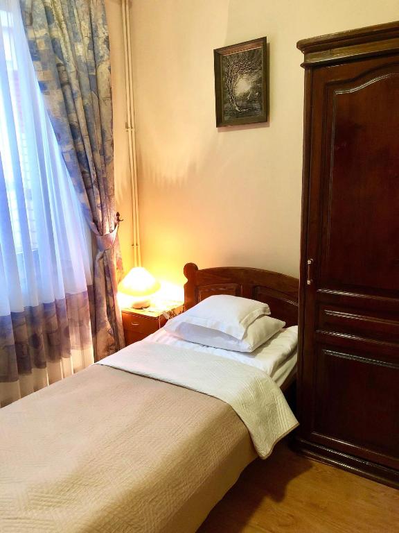 Postel nebo postele na pokoji v ubytování Atlant Hotel