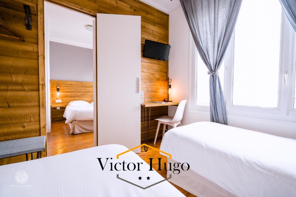 Postel nebo postele na pokoji v ubytování Hôtel Victor Hugo Lorient