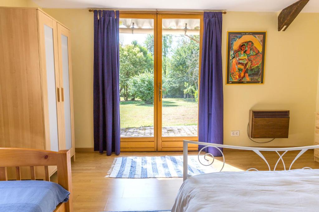 Postel nebo postele na pokoji v ubytování Peyrouteau, gîte bucolique.