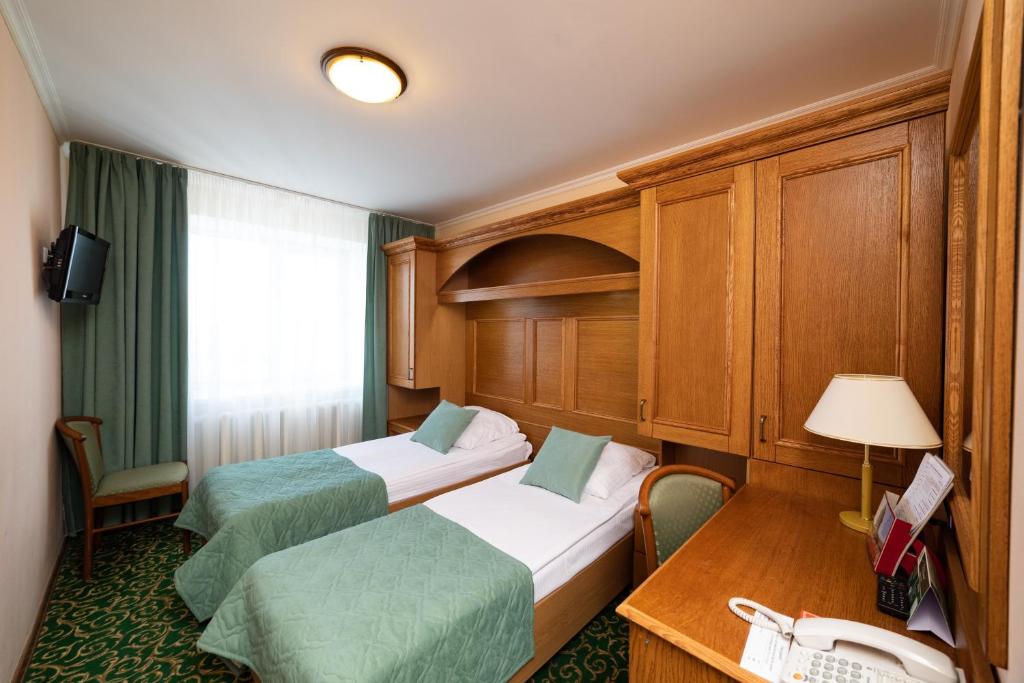 Кровать или кровати в номере Гостиница Коломна