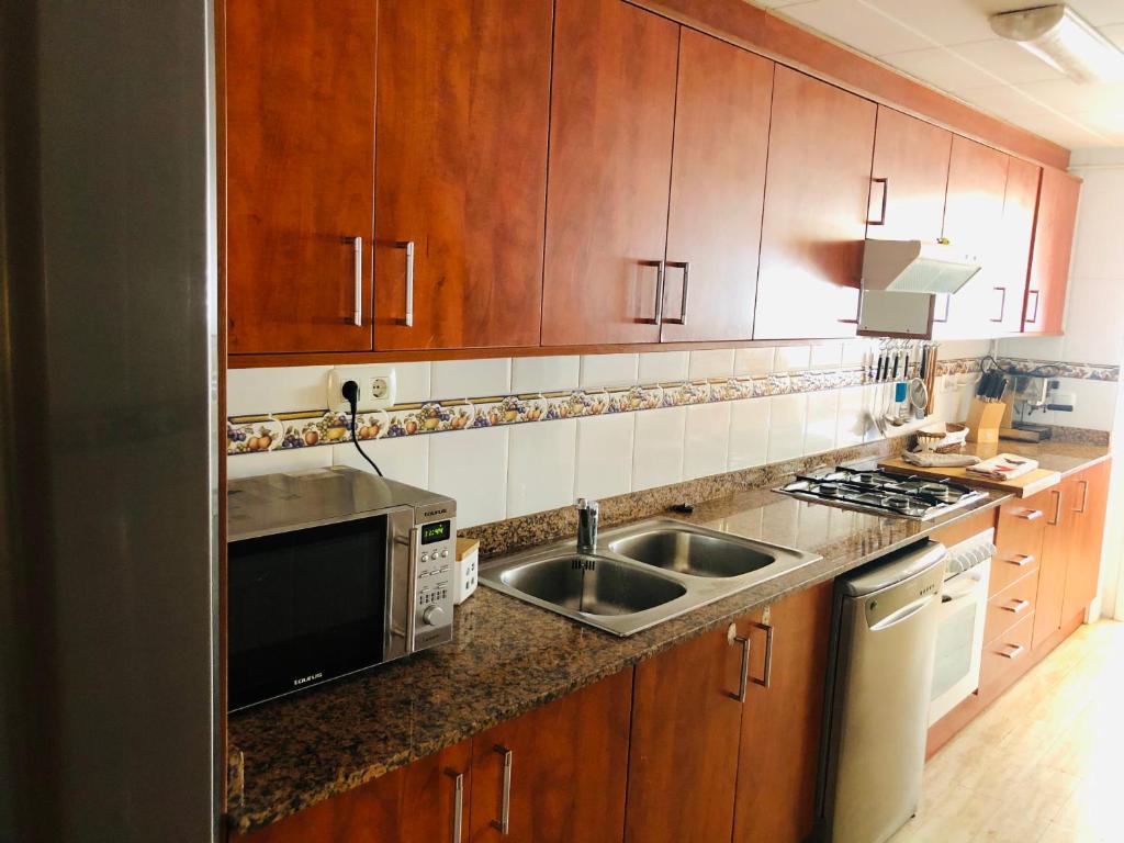 Kuchyňa alebo kuchynka v ubytovaní Apartamento con terraza y piscina en Malgrat de Mar