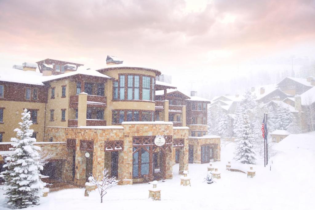 a large building with a snow covered ski slope at The Chateaux Deer Valley in Park City