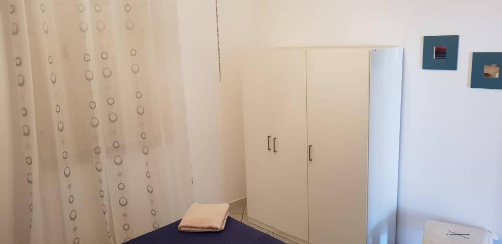 Postel nebo postele na pokoji v ubytování L'Incanto di Cala Feola