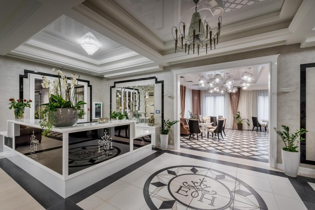 a rendering of a living room with a chandelier at Evita Hotel & SPA in Tleń