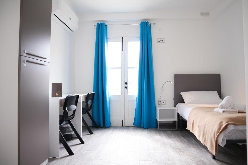Postel nebo postele na pokoji v ubytování AM Hostel