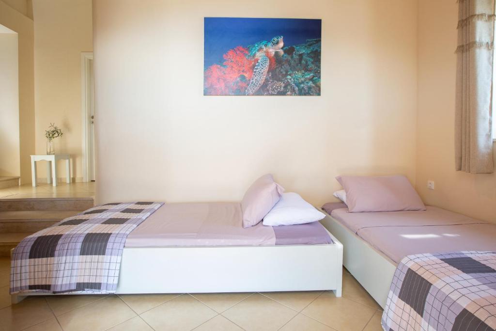 Postel nebo postele na pokoji v ubytování Ionian View Villas