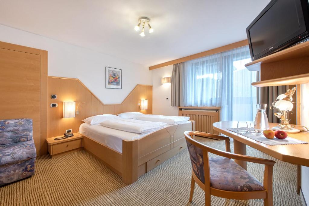 Postel nebo postele na pokoji v ubytování Hotel Hubertushof