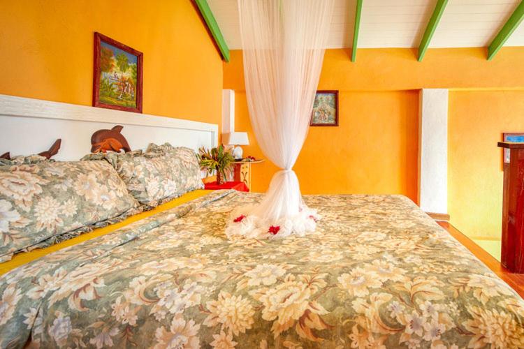 Postel nebo postele na pokoji v ubytování Villa Des Pitons
