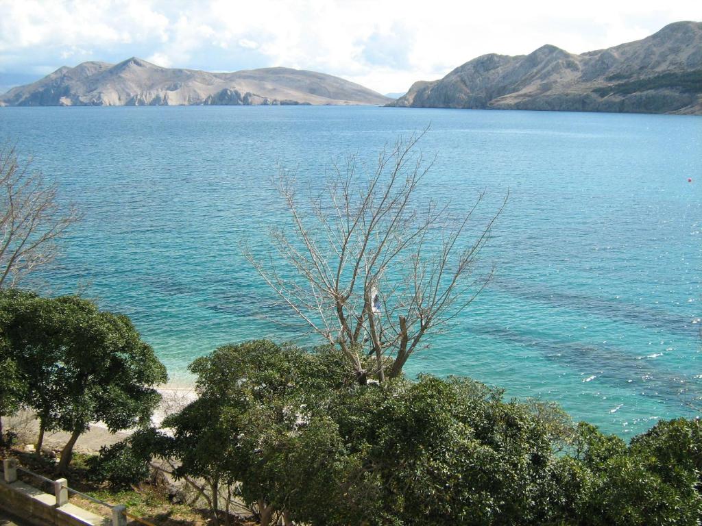 a view of a large body of water with mountains at Villas Corinthia in Baška