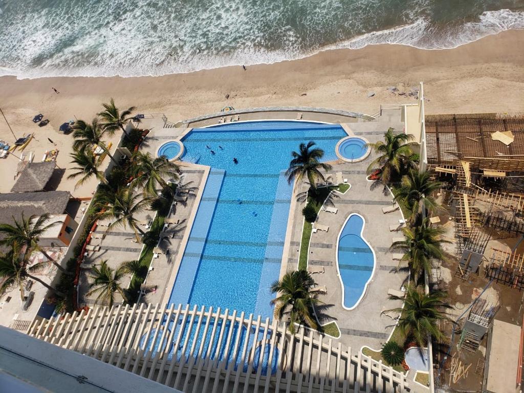 an overhead view of a swimming pool on the beach at Big Luxury Condo - Zona Dorada in Mazatlán