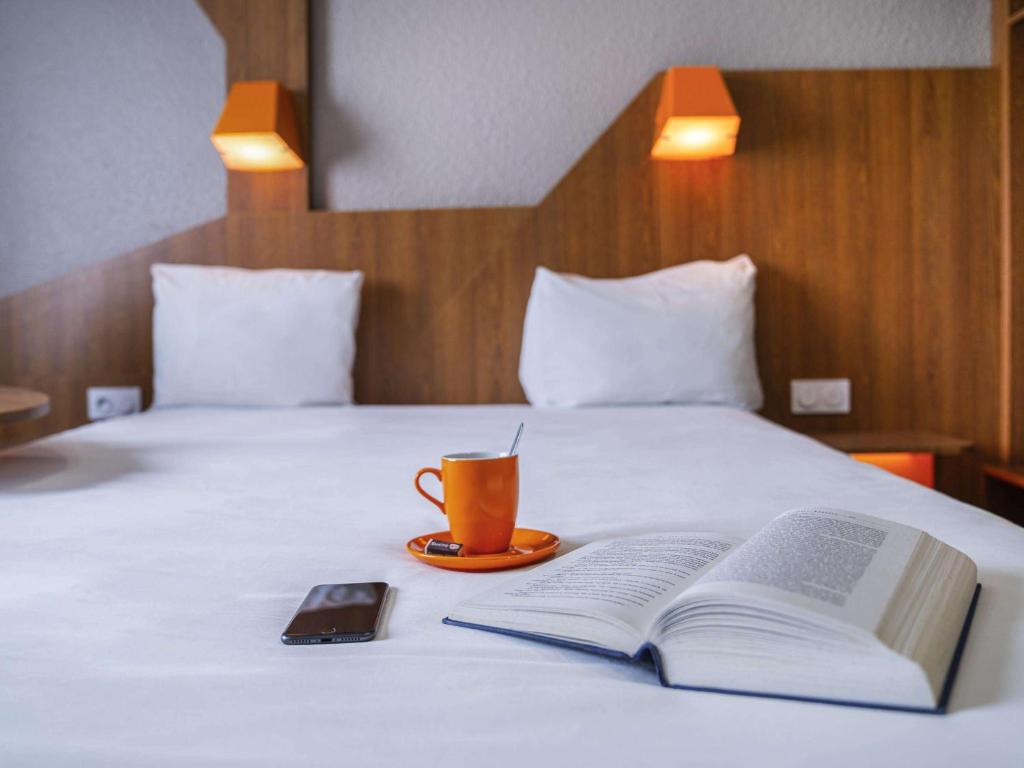 Postel nebo postele na pokoji v ubytování ibis Styles Gien